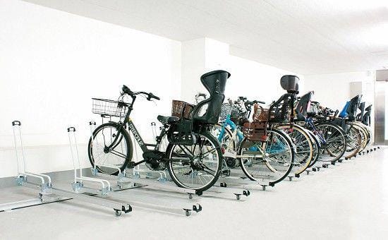 マンション駐輪場に電動自転車対応のスライド式自転車ラックを採用